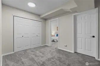 This is the Bonus Room space. The Laundry and Cellar are off this space. It's large enough to make another Office or Play Room, too!