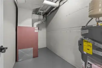 Mechanical Room - super clean!! New Rheem 45-Gallon Electric Water Heater. Oil Furnace in great shape! This is a great space for some extra storage, too.