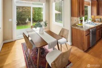 The breakfast nook & hardwood floors throughout the kitchen and entry way of the house