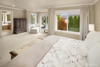 The primary bedroom with big windows looking out to the backyard, nice sitting area or desk area, crown molding, and a Luxurious 5 piece bathroom
