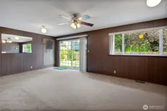 Virtually staged to show possibilities. Second living room / bonus room with sliding glass door leading to patio and fully fenced backyard.