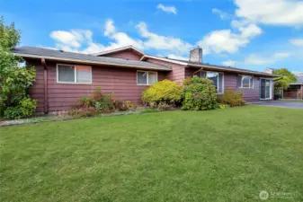 Fully fenced and landscaped backyard.