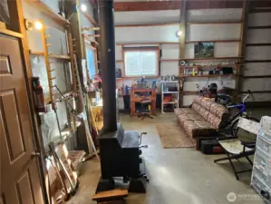 Wood burning stove near the shop area.