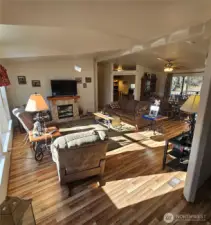 The light filled living room with the pitched ceiling is open and comfortable.