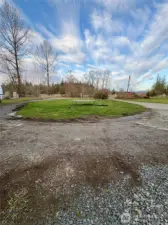 Circular driveway to concrete pad