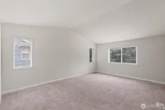 Primary bedroom as a blank slate. So much room for furniture, a seating area, or exercise equipment.
