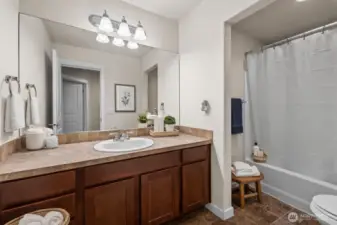 Main bath upstairs. Virtually staged.