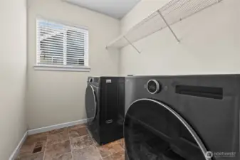 Convenient utility room on the upper level.