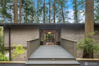 A cool bridge takes you from the driveway to your front door in this 1972 Richmond Highlands home with striking MCM design influences.