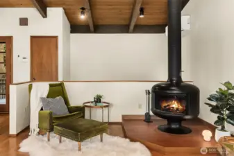 An Eames Lounge Chair would be right at home in this cozy spot next to the fireplace.