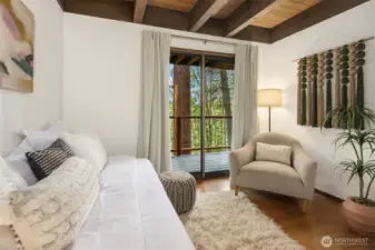 The third bedroom nicely accommodates a twin bed, plus room for a desk area or seating as shown here.  Imagine all of your bedrooms featuring doors to lovely outdoor deck space.