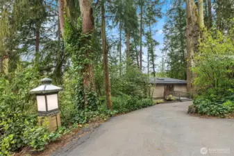 Tucked away off of a quiet street...an architectural gem nestled amongst the trees.