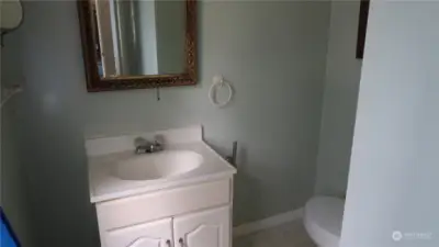 Upstairs half bath.