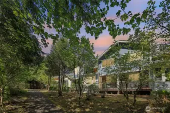 Perfectly situated with deck view of forest and pathway. Peaceful