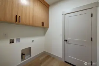 Utility room and doorway to garage