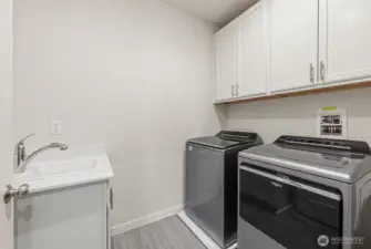 Utility Room w/ W&D, Storage Cabinetry, & Quartz Top Utility Sink!