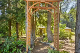 Tranquil garden path leads you to the front of the home.
