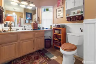 Large full bath on the main level serves the lower two bedrooms.