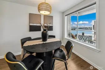 Dining space with a view. The living room is wide, so there is room for both living and dining at the windows.