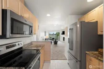 Glass cooktop and space saving microwave above.