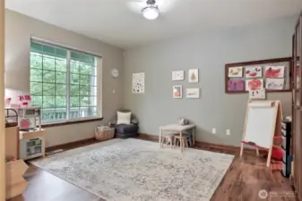 On your left at entry is a large living room, currently used as a playroom for their kiddos.