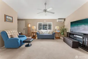 Looking from the den to the large, central living room