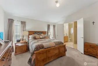 Large primary suite, double doors leading to the oversized full bath and walk-in closet to the right.