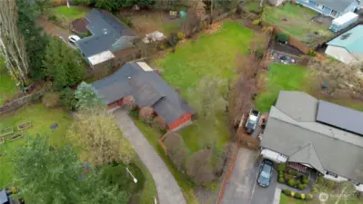 Drone shot of the home and yard.  Neighborhodd as a small community park and mailbox cluster you will see as you drive into the home.
