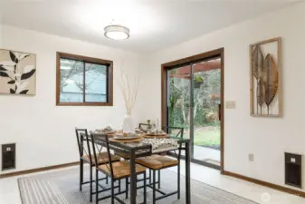 Very cheery dining room.  Note two wall heaters here.