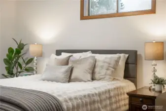 All three bedrooms are south-facing towards the backyard off of a hallway.