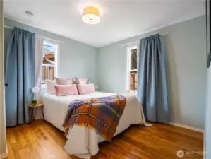 The primary bedroom is located on the main floor and have a view of the backyard.