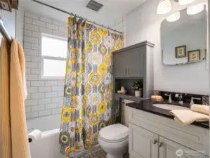 The full bath on the main level is tastefully remodeled.