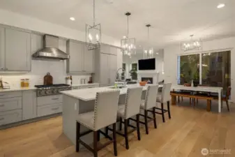 This gourmet kitchen is sure to please with abundant cabinetry, solid surface countertops, complemented by bright white subway tile.