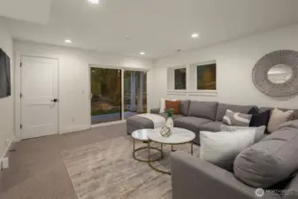 The lower level is a daylight basement, generous in space, flexing a large rec room with a walk-out covered outdoor space to enjoy.