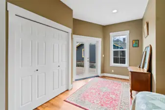 French doors lead to the deck off of the primary suite.