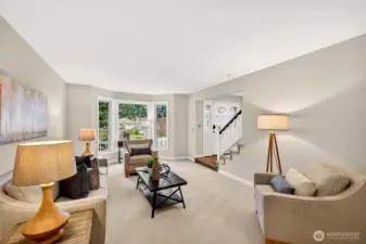 The layout connects the living and dining areas with an easy flow, perfect for everyday living and entertaining. Natural light and clean sightlines make the main level feel open and welcoming.