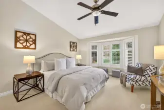 The primary suite is a calm, spacious retreat with a vaulted ceiling and a sunny bay window finished with plantation shutters. Soft natural light and a comfortable layout make it easy to create a true unwind zone at the end of the day.