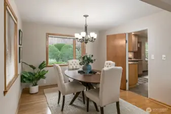 The formal dining area is adjacent to the main living area....  Easy to extend a table to accommodate a large gathering.... Notice the hardwood floors extend into this area too.... and how convenient it is to the kitchen!