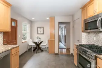There is a casual eating area off the kitchen.  The built-in cabinets in that area would make a nice morning beverage station!  Also notice the door which goes out to the private rear yard and patio great for entertaining and BBQs