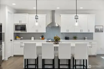 Spacious walk-in pantry provides ample room to organize small appliances, pantry staples and gourmet ingredients-keeping the kitchen beautifully functional and clutter-free.
