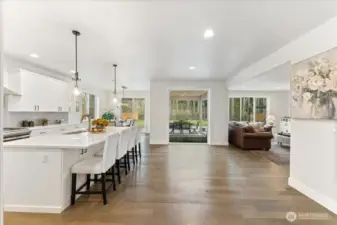 A dramatic oversized window floods the space with natural light, seamlessly bringing the NW beauty of the outdoors inside. The seller added a custom bubbling fountain which adds a soothing, resort-style serenity to the outdoor space.
