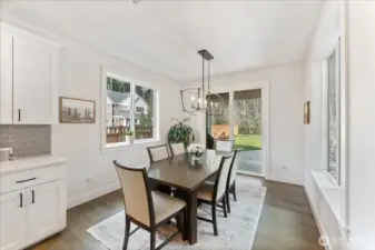 Formal Dining Space with stylish lighting that opens to a covered patio-ideal for everyday enjoyment.