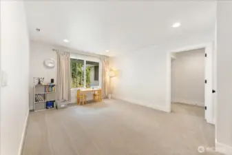 At the top of the stairs, a spacious open loft unfolds, offering a versatile area perfect for a home office, playroom,   media space,or casual gathering area, adaptable to your lifestyle needs.