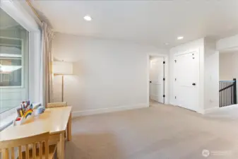 Another perspective of the loft, emphasizing the adaptable space for family and activities.