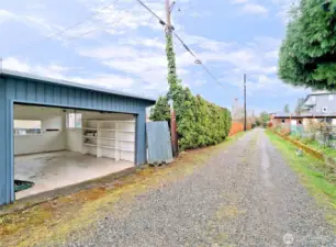 Alley access to large garage with newer roof.