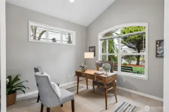 The main floor office features a vaulted ceiling, double-door entry and a large picture window overlooking the front yard creating a bright and inspiring workspace.