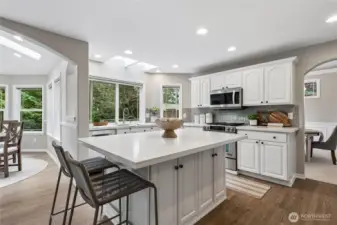 SS appliances include Bosch Dishwasher, JennAir Range, Microwave and a brand-new LG smart refrigerator. Abundant recessed lighting enhances the space, while the island offers seating, prep and serving functionality with generous cabinetry on each side of the island.