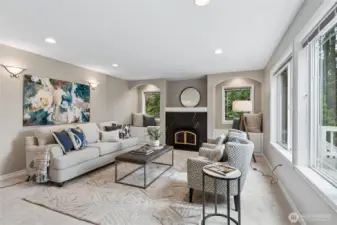 Adjoining the kitchen and breakfast nook, the gracious family offers a warm and inviting gathering space.