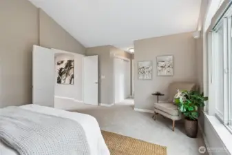 The hallways leading to the bath area has closets on each side including a walk-in closet with newly installed organizational system offering ample hanging space and additonal drawers