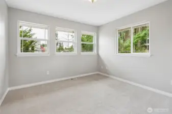 The corner NE bedroom is a well sized room with abundant windows and large closet.